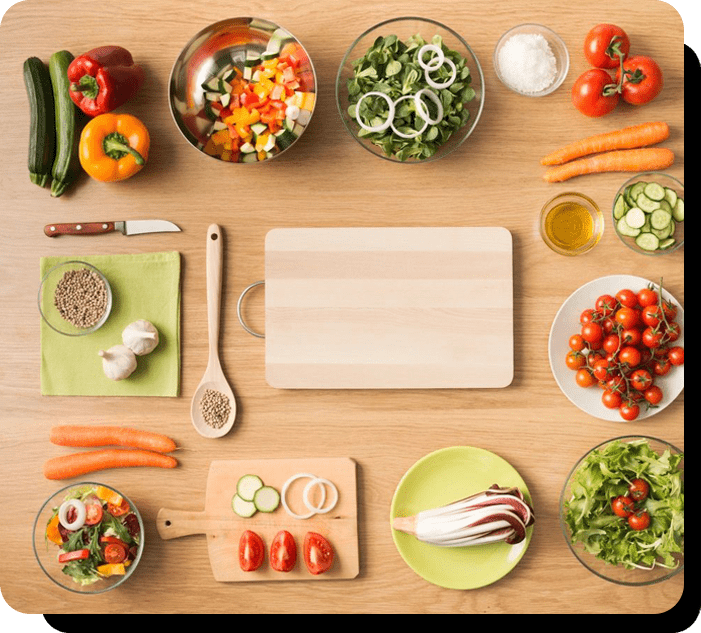 A wooden table topped with lots of different vegetables.